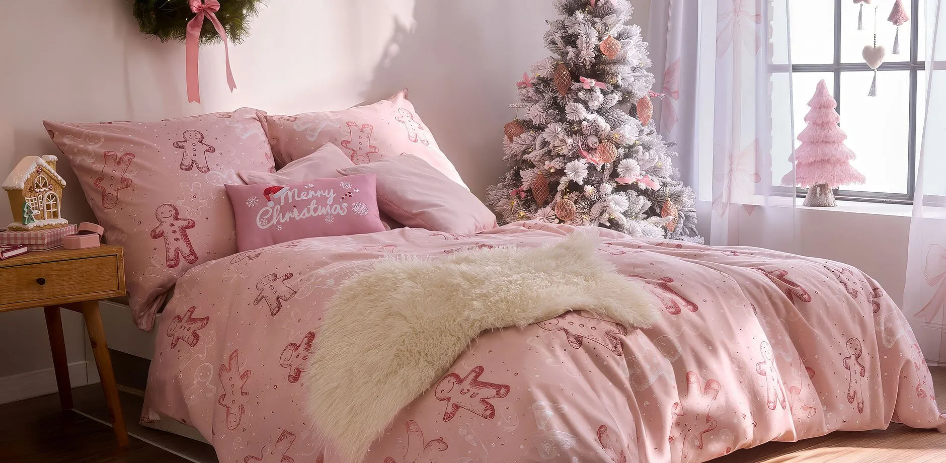 Parure de lit de No&euml;l de couleur rose.