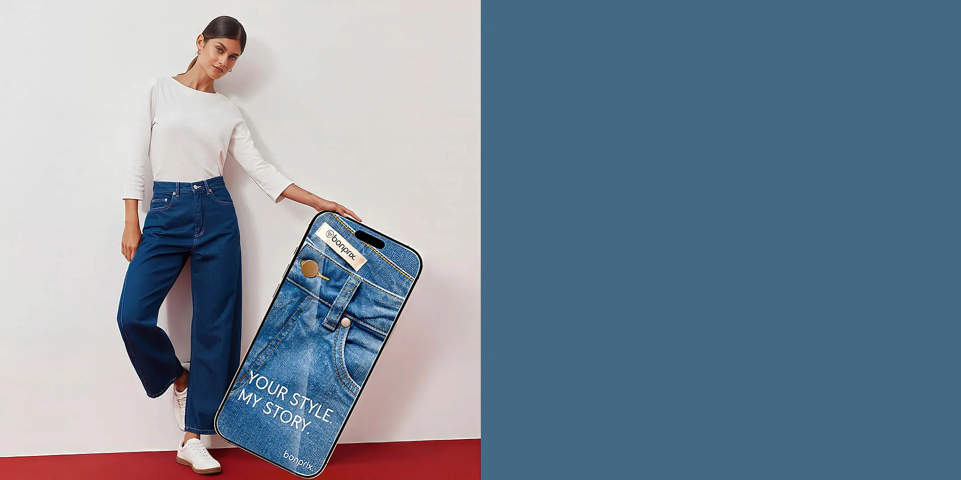 Wei&szlig;es Oberteil, modische weite Jeans und Sneaker.