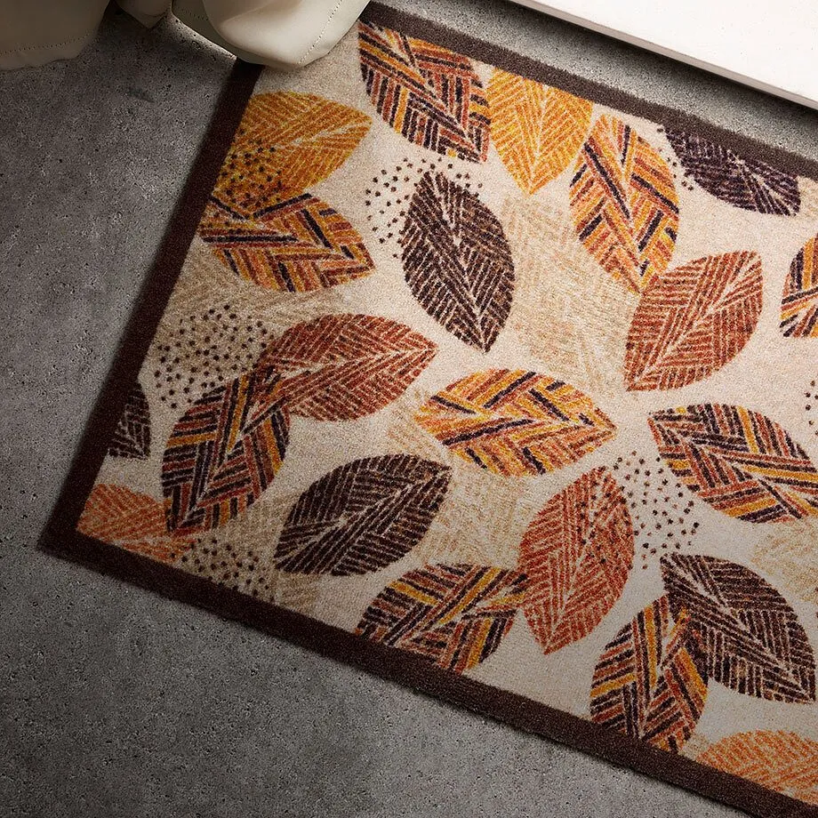 Paillasson avec un motif feuilles.