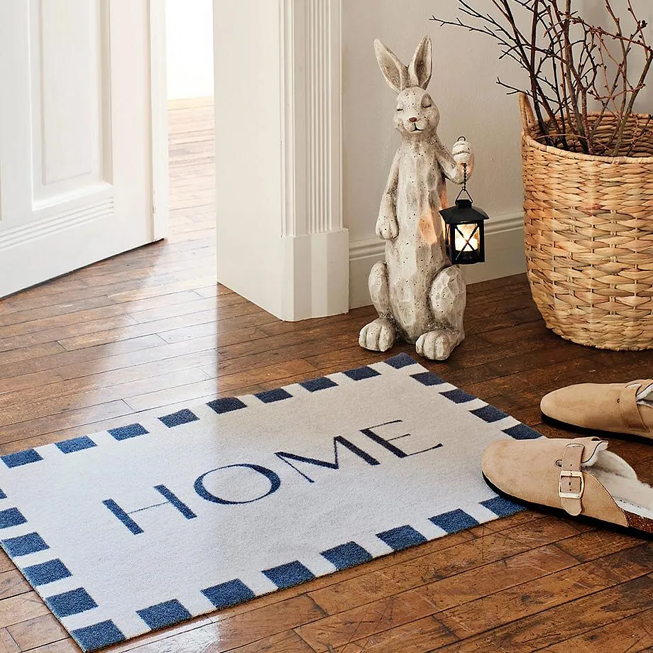 Tapis de protection avec inscription "HOME".