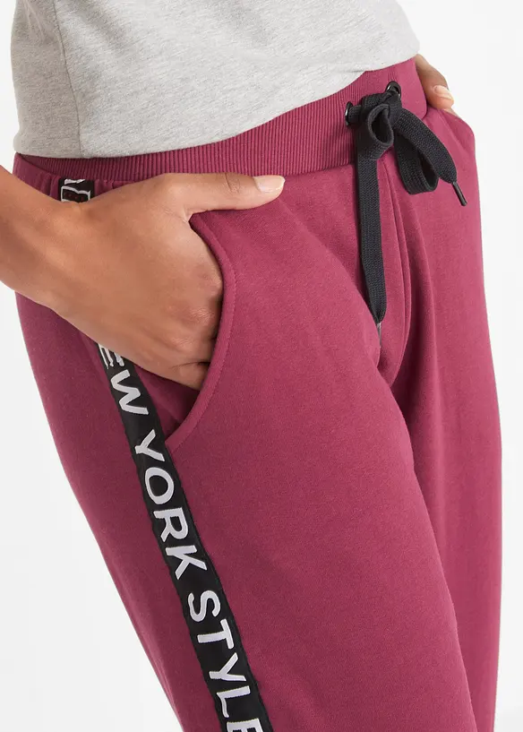 Pantalon en molleton avec lien à nouer et message imprimé, bonprix